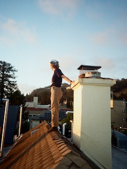 a wolf (a co-oper who lives at Wolf) standing on the roof leaning against the chimney