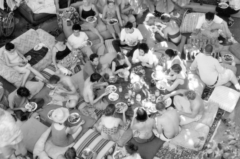 Members of Lothlorien coop enjoying a meal.
